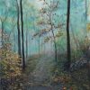A misty autumn woodland, a leaf-strewn path between bare trees.