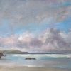 Sango Sands: a sandy beach with rocks and breaking waves under a pink and grey sky.