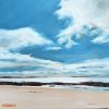 Beach: a wide sandy beach under blue sky and big white clouds.