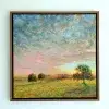 Trees in an open meadow beneath a wide sky streaked with pink and blue.