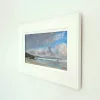Sango Sands in a white frame, seen from the side on a white wall.