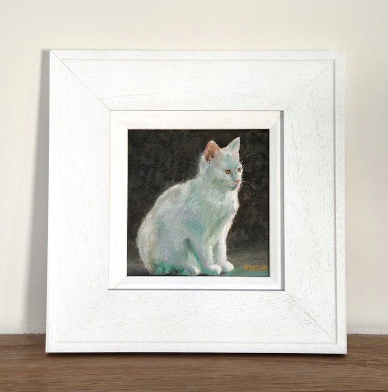 Oil portrait of a pet in its white frame